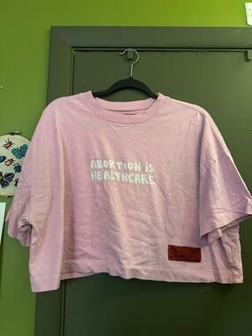 CHNGE cropped pink top size XL shirt ”Abortion is Healthcare”